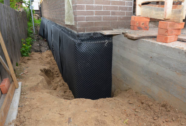 SJ Waterproofing Pros technician performing targeted Exterior Waterproofing assessment in Georgetown, IN